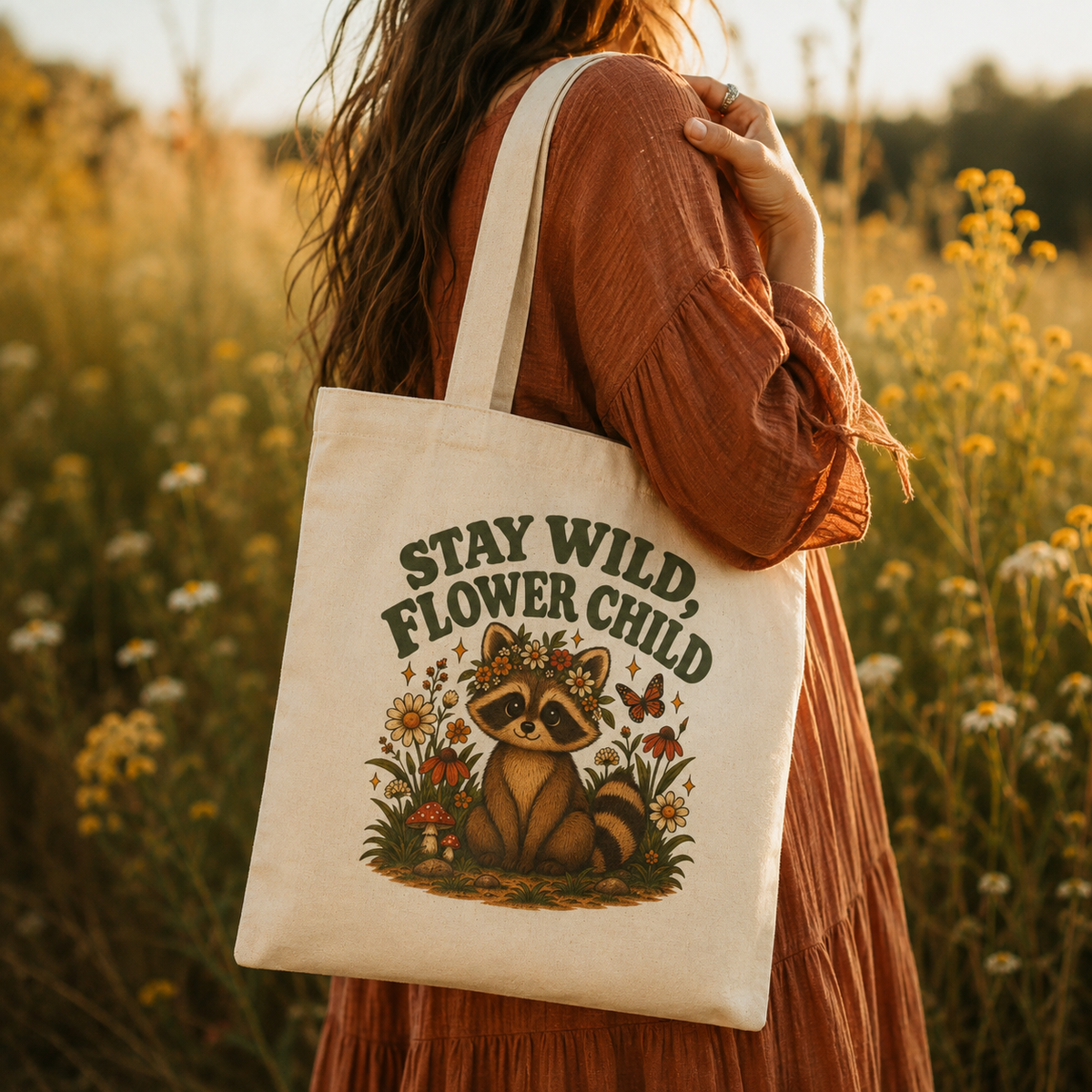 Model carrying Stay Wild Flower Child raccoon canvas tote